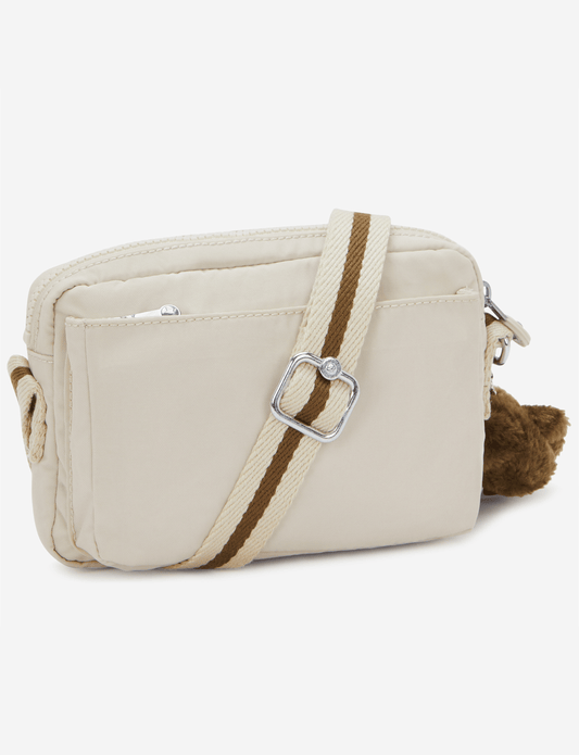 KIPLING حقيبة أبانو كروس بودي صغيرة بلون رملي ناعم I4208-9LO