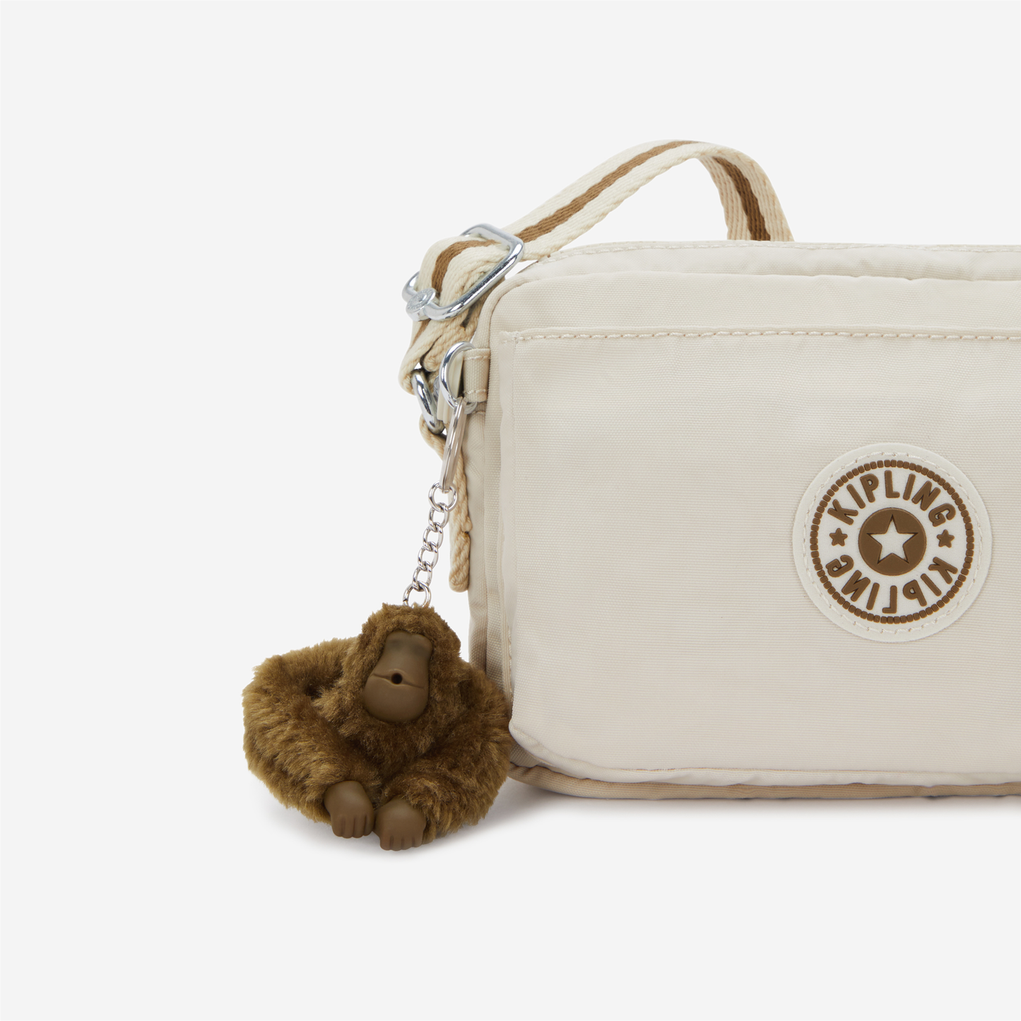 KIPLING حقيبة أبانو كروس بودي صغيرة بلون رملي ناعم I4208-9LO