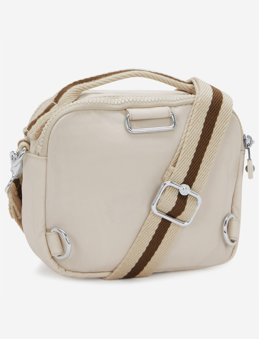 حقيبة كروسبودي صغيرة KIPLING Cahir بلون رملي ناعم (قابلة للتحويل إلى حقيبة ظهر) I8061-9LO