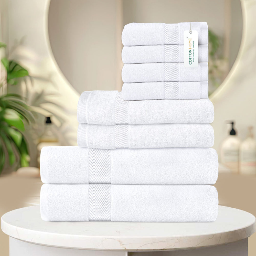 طقم مناشف قطنية فاخرة من كوتون هوم، مكون من 8 قطع: 4 مناشف للوجه (30×30 سم)، منشفتان لليدين (40×70 سم)، منشفتان للاستحمام (70×140 سم)، وزن 600 غرام/متر مربع، سريع الجفاف ومتين.