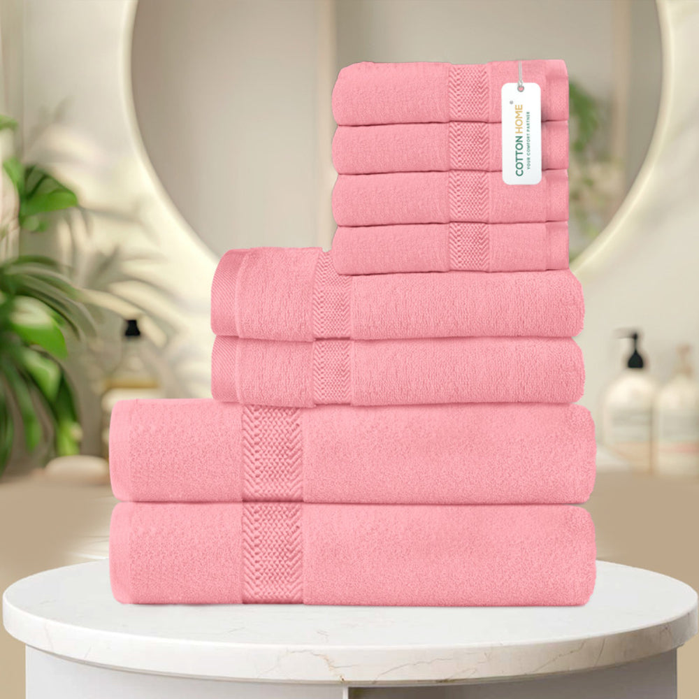 طقم مناشف قطنية فاخرة من كوتون هوم، مكون من 8 قطع: 4 مناشف للوجه (30×30 سم)، منشفتان لليدين (40×70 سم)، منشفتان للاستحمام (70×140 سم)، وزن 600 غرام/متر مربع، سريع الجفاف ومتين.