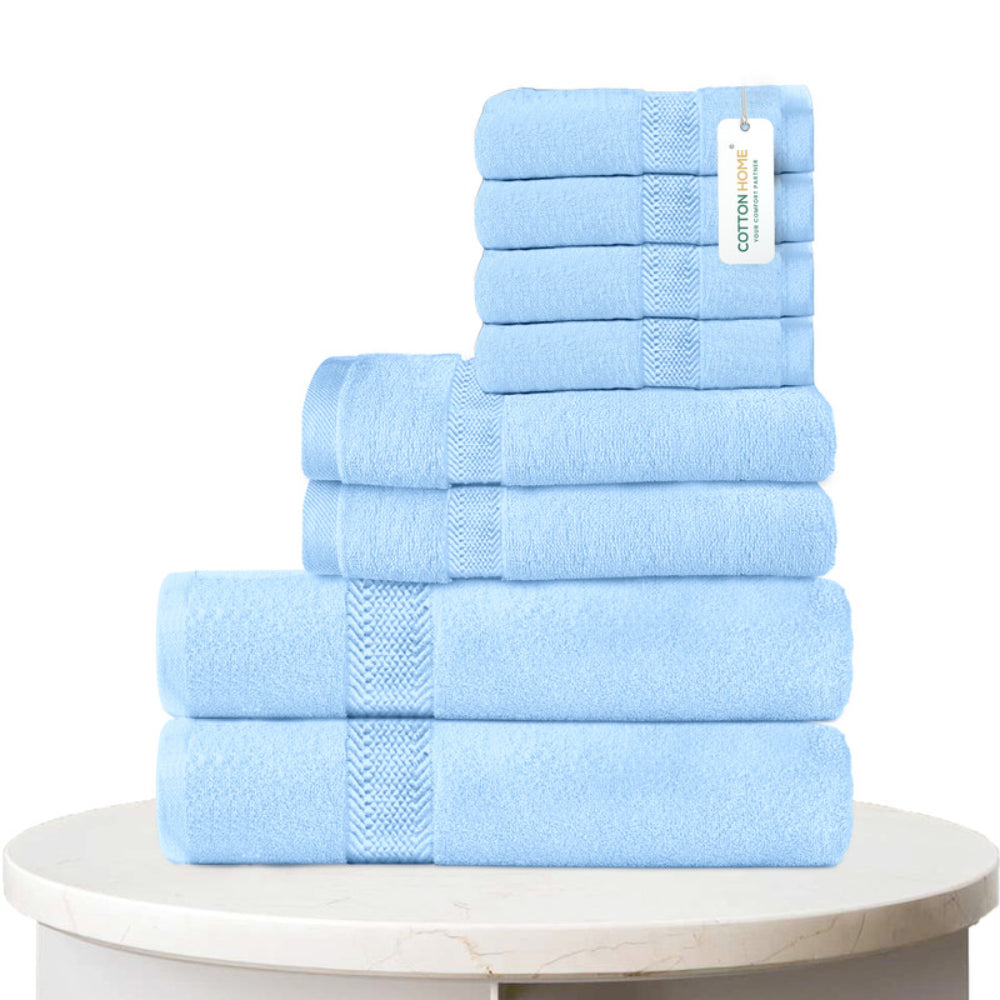 طقم مناشف قطنية فاخرة من كوتون هوم، مكون من 8 قطع: 4 مناشف للوجه (30×30 سم)، منشفتان لليدين (40×70 سم)، منشفتان للاستحمام (70×140 سم)، وزن 600 غرام/متر مربع، سريع الجفاف ومتين.