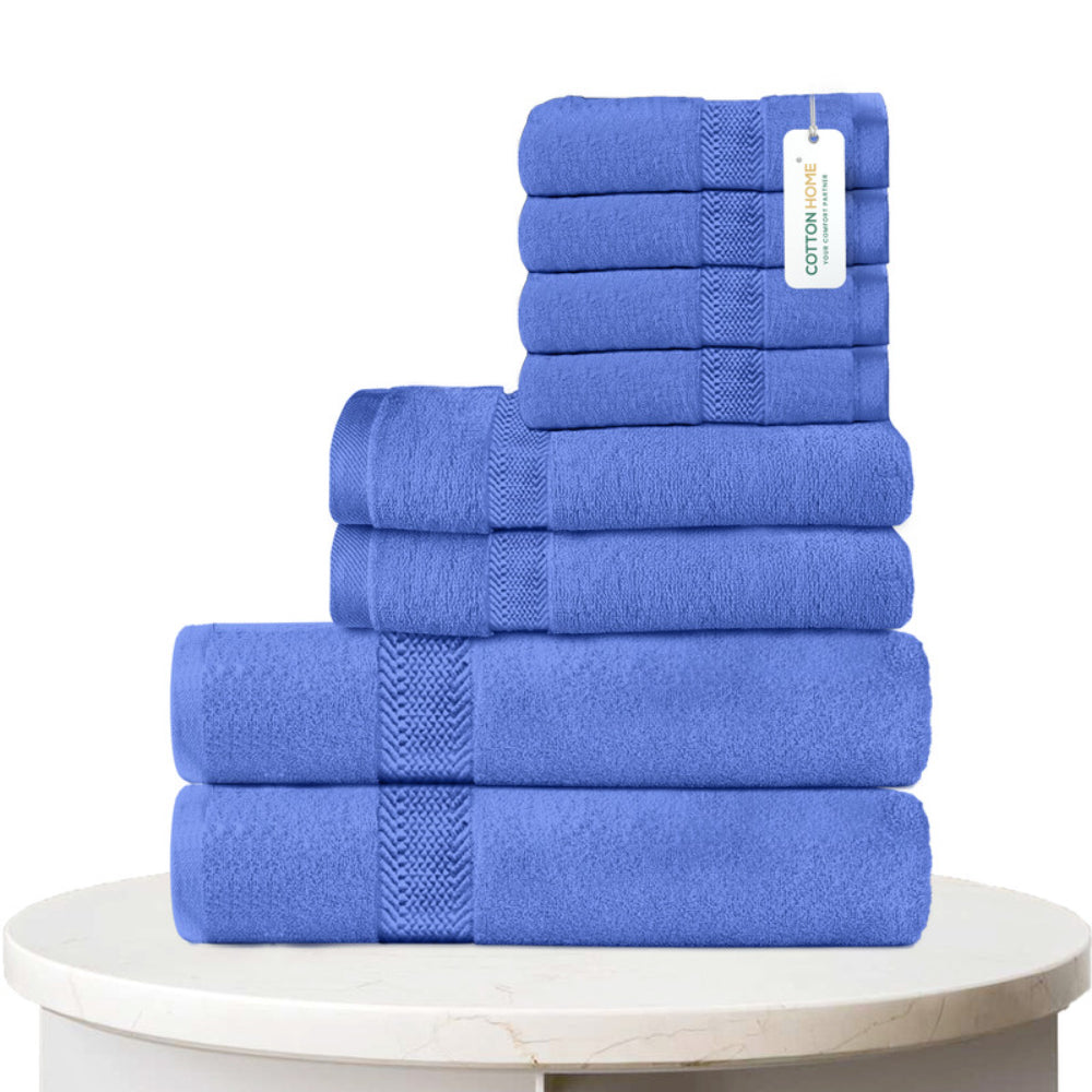 طقم مناشف قطنية فاخرة من كوتون هوم، مكون من 8 قطع: 4 مناشف للوجه (30×30 سم)، منشفتان لليدين (40×70 سم)، منشفتان للاستحمام (70×140 سم)، وزن 600 غرام/متر مربع، سريع الجفاف ومتين.