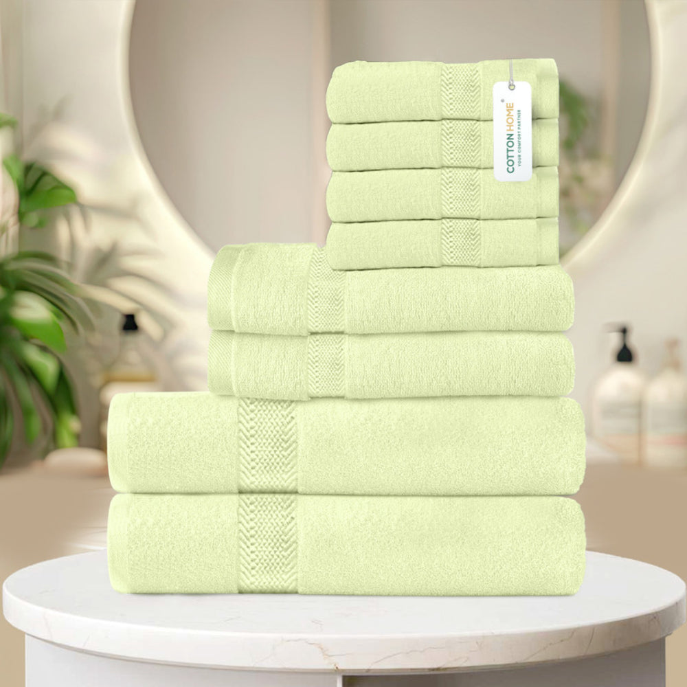 طقم مناشف قطنية فاخرة من كوتون هوم، مكون من 8 قطع: 4 مناشف للوجه (30×30 سم)، منشفتان لليدين (40×70 سم)، منشفتان للاستحمام (70×140 سم)، وزن 600 غرام/متر مربع، سريع الجفاف ومتين.
