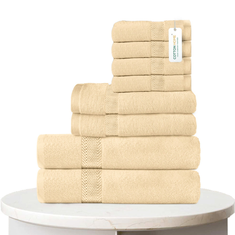 طقم مناشف قطنية فاخرة من كوتون هوم، مكون من 8 قطع: 4 مناشف للوجه (30×30 سم)، منشفتان لليدين (40×70 سم)، منشفتان للاستحمام (70×140 سم)، وزن 600 غرام/متر مربع، سريع الجفاف ومتين.