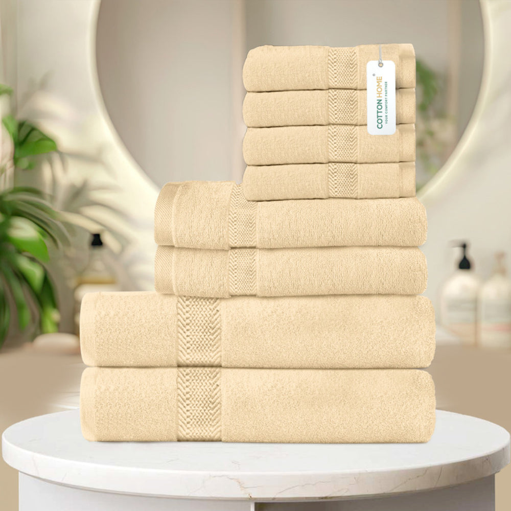 طقم مناشف قطنية فاخرة من كوتون هوم، مكون من 8 قطع: 4 مناشف للوجه (30×30 سم)، منشفتان لليدين (40×70 سم)، منشفتان للاستحمام (70×140 سم)، وزن 600 غرام/متر مربع، سريع الجفاف ومتين.