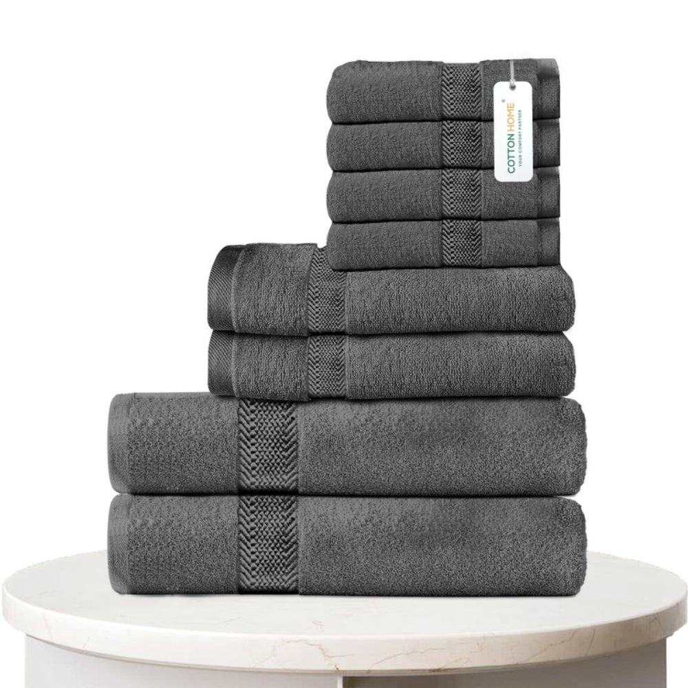طقم مناشف قطنية فاخرة من كوتون هوم، مكون من 8 قطع: 4 مناشف للوجه (30×30 سم)، منشفتان لليدين (40×70 سم)، منشفتان للاستحمام (70×140 سم)، وزن 600 غرام/متر مربع، سريع الجفاف ومتين.