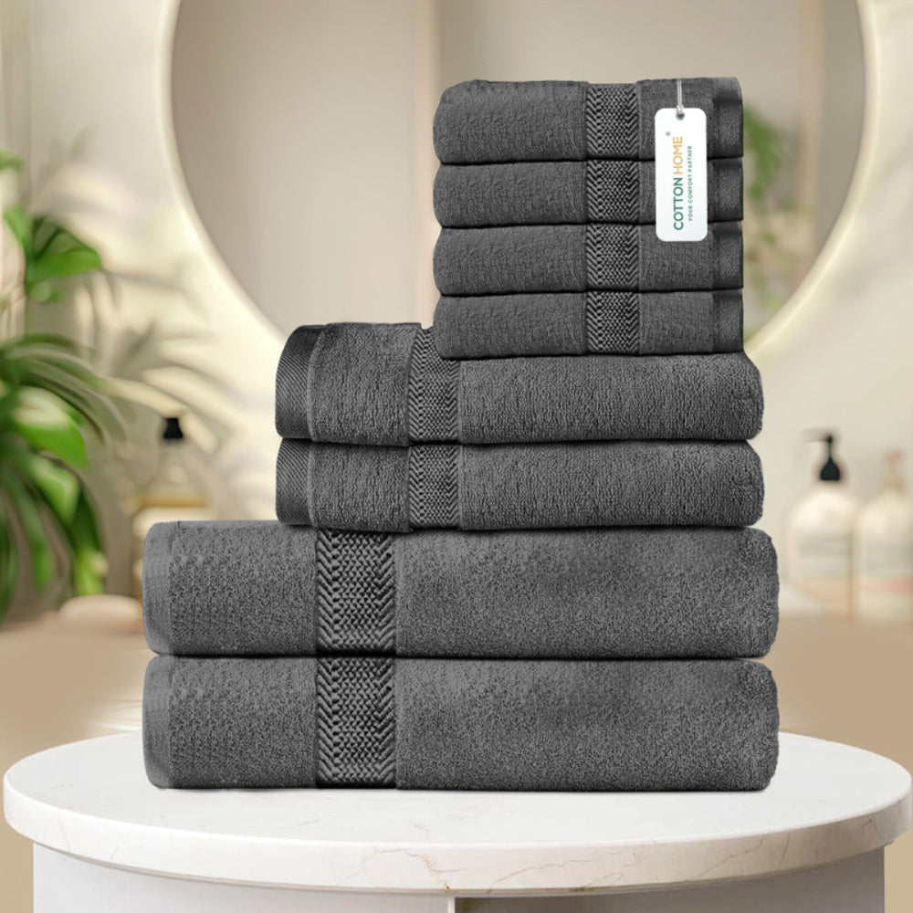 طقم مناشف قطنية فاخرة من كوتون هوم، مكون من 8 قطع: 4 مناشف للوجه (30×30 سم)، منشفتان لليدين (40×70 سم)، منشفتان للاستحمام (70×140 سم)، وزن 600 غرام/متر مربع، سريع الجفاف ومتين.