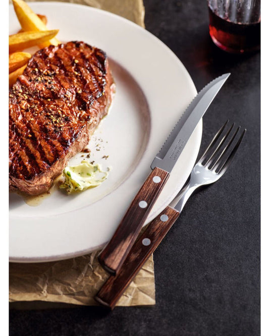 ترامونتينا منذ عام 1911، صنع في البرازيل، طقم أدوات مائدة ترامونتينا مكون من 12 قطعة بشفرات من الفولاذ المقاوم للصدأ ومقابض من الخشب البني المعالج