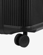 حقيبة ديلسي باريس ستون الصلبة ذات العجلات الأربع