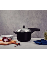 ترامونتينا منذ عام 1911، صنع في البرازيل، طنجرة ضغط من الألومنيوم الأسود بتأثير فانكوفر من ترامونتينا، مع طبقة ستارفلون ماكس غير لاصقة داخلية وخارجية، 20 سم، 4.5 لتر