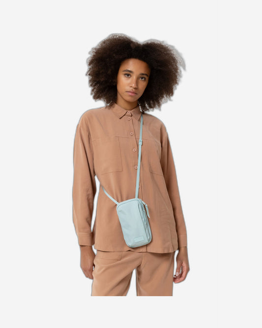 حقيبة صغيرة من إيستباك سي إن سي تي إف، لون فيروزي