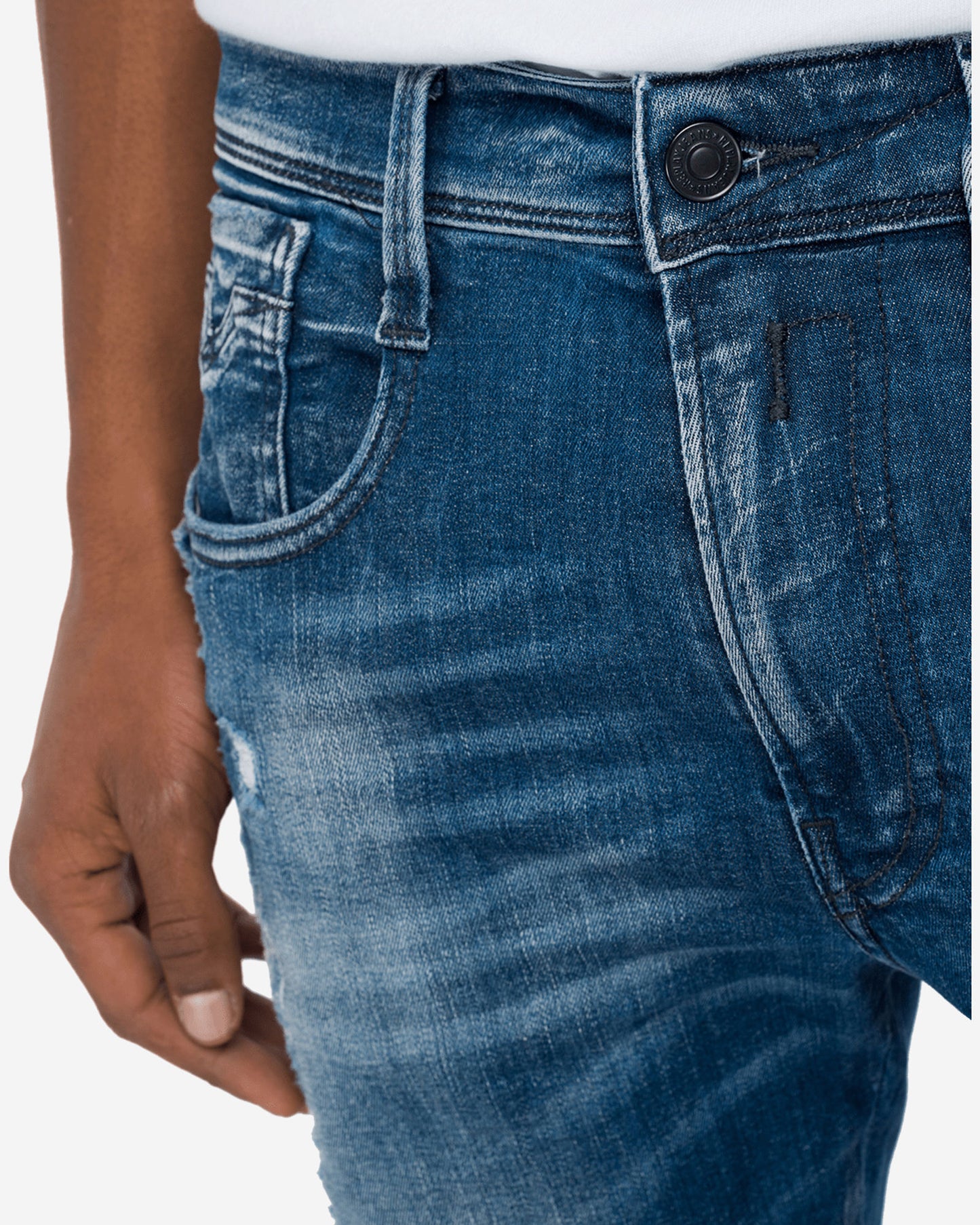 بنطال جينز بروني بقصّة Slim Fit