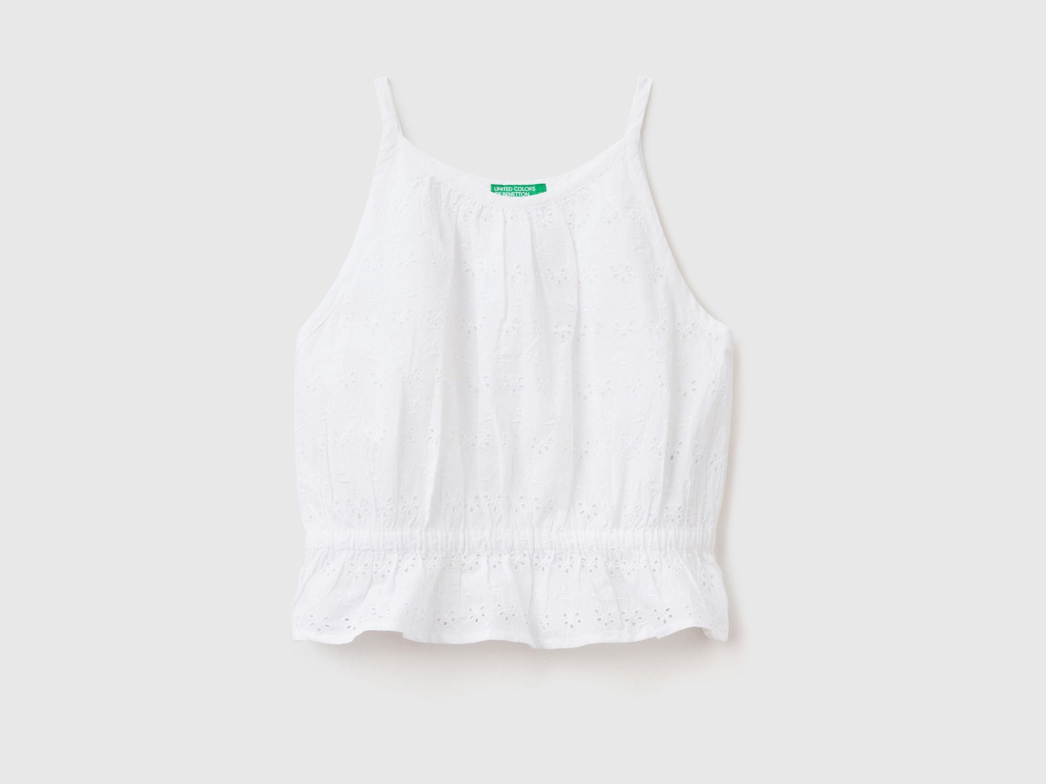 Top with broderie anglaise embroidery