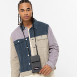 حقيبة دالر صغيرة من إيست باك، مصنوعة من قماش الدنيم الأسود، بتصميم كروس بودي - EK0A5BE777H1